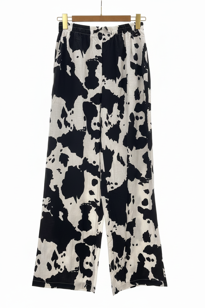 Pantalón cow print con percha dorada