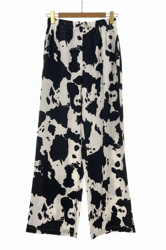 Pantalón cow print con percha dorada